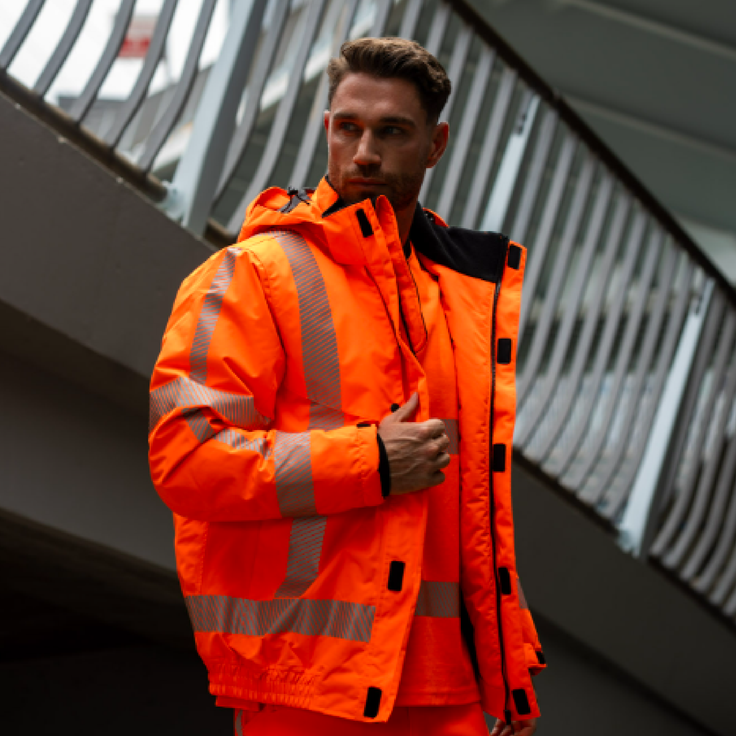 Male model wearing pilot jacket revisible in orange