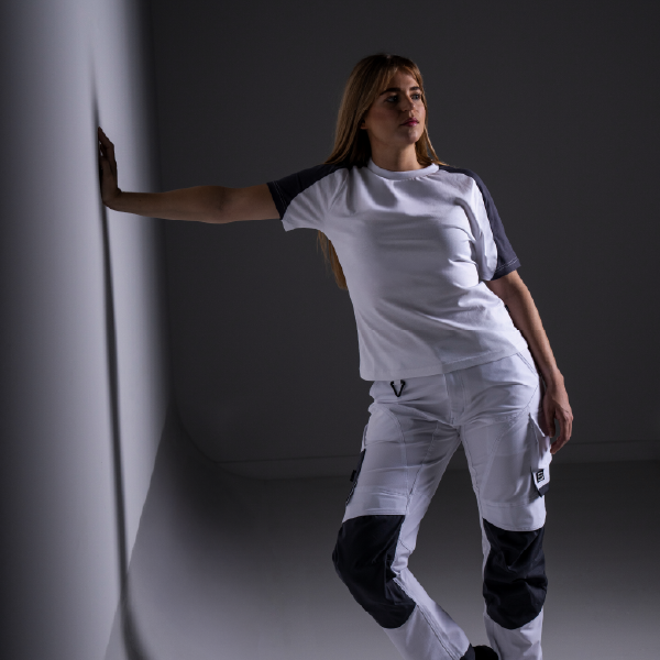 Female model wearing a bicolor T-shirt and work trousers